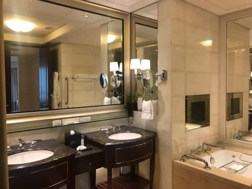 a bathroom with a large mirror and sinks