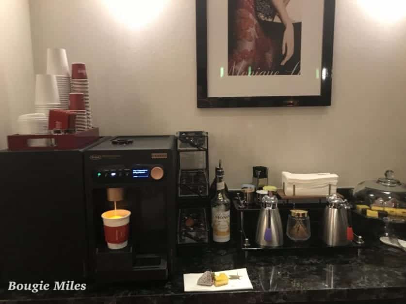 a coffee machine and a picture on the wall