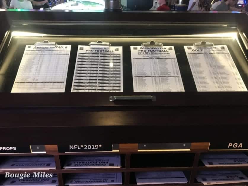 a display case with several football score boards