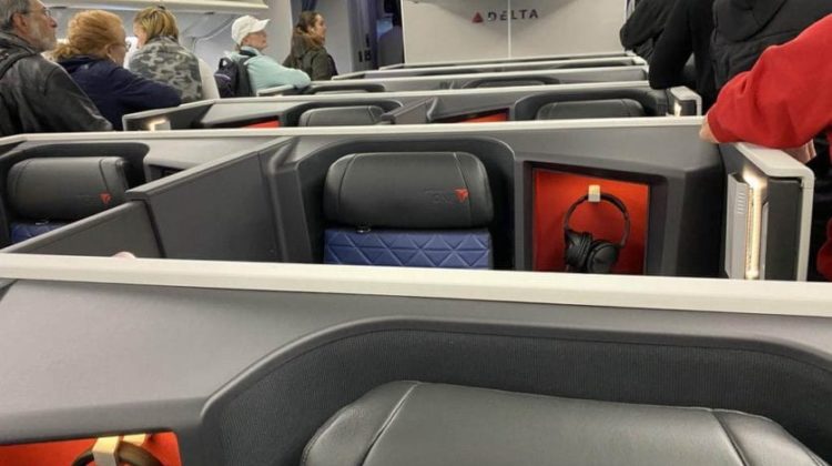 a group of people sitting in an airplane