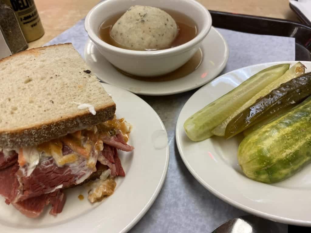 a plate of food with a sandwich and soup on it