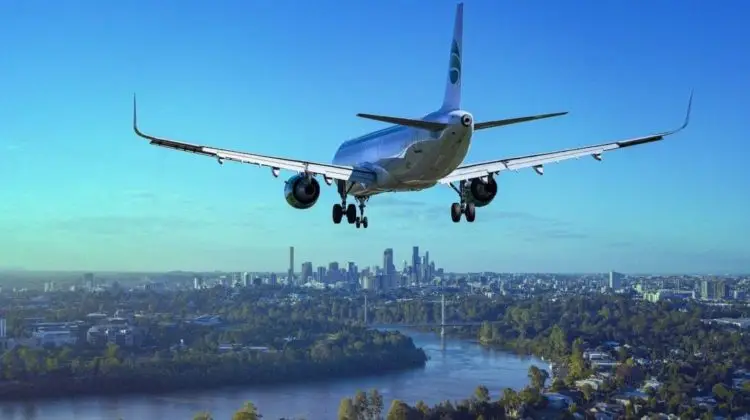 a plane flying over a city