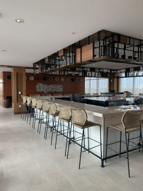 a bar with chairs in a room