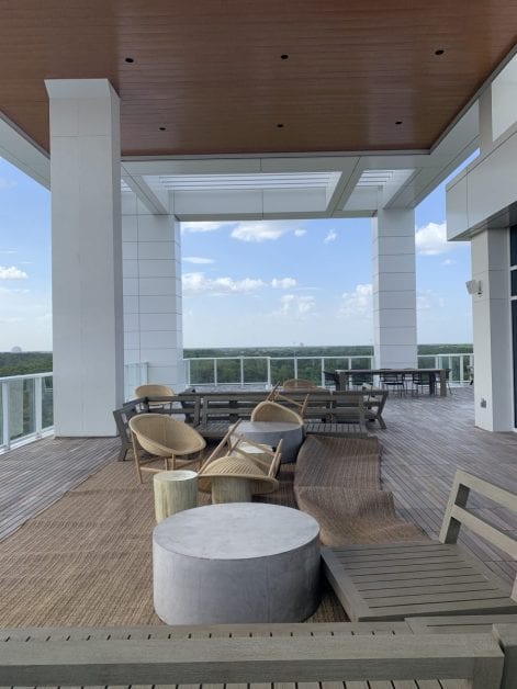 a patio with chairs and tables