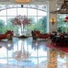 a large room with a tree and red lanterns