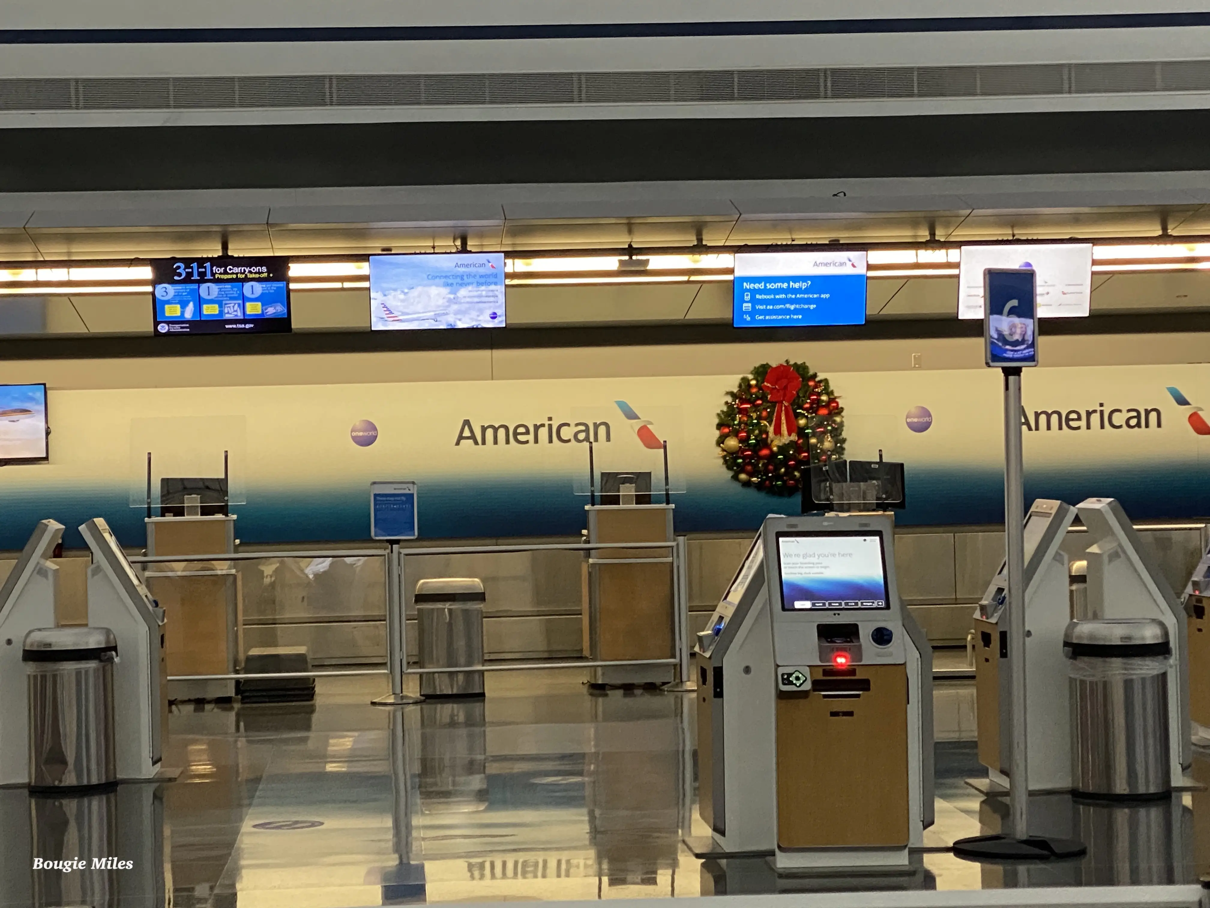 an airport with an electronic check-in area