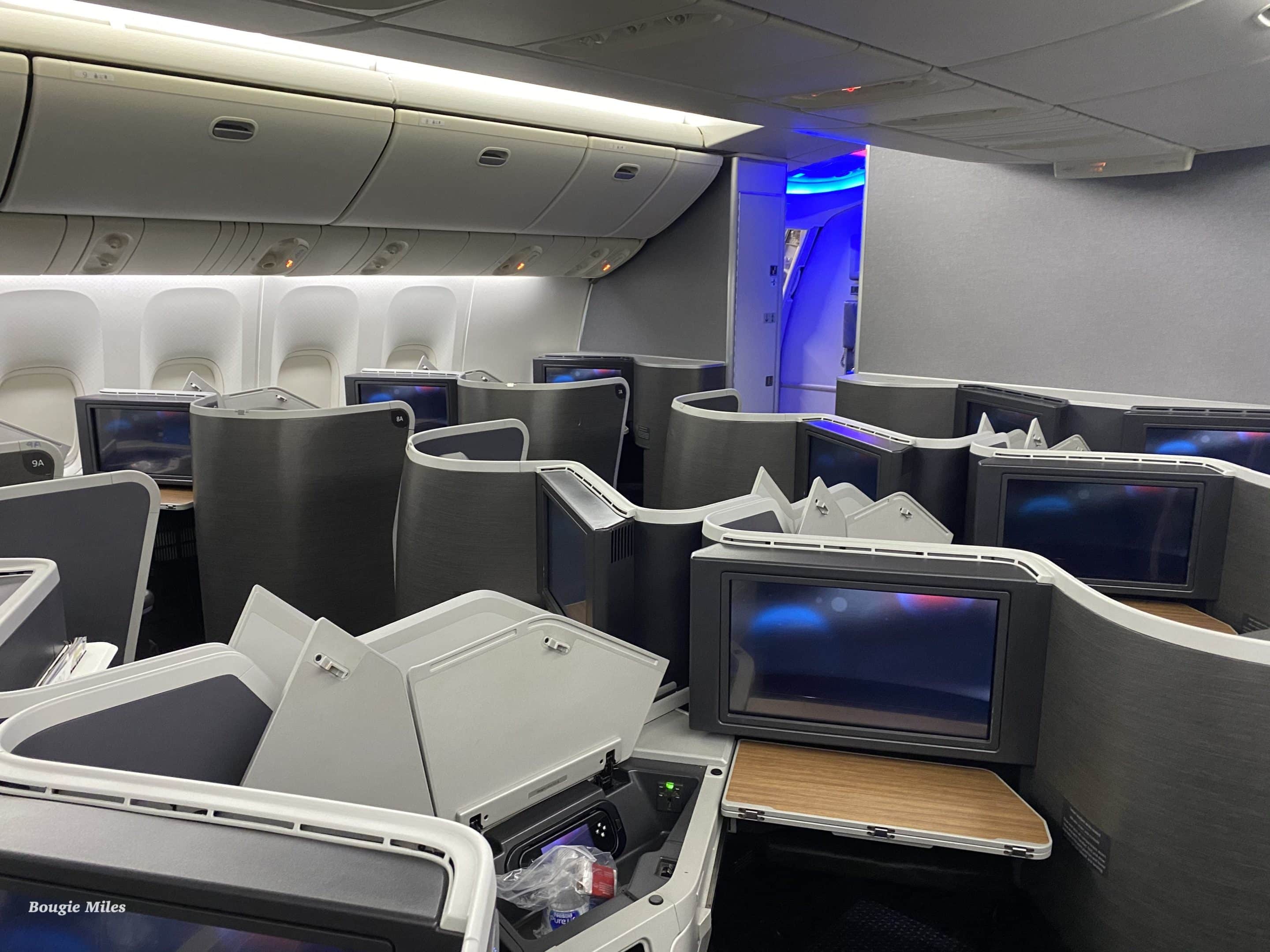 a group of televisions on an airplane