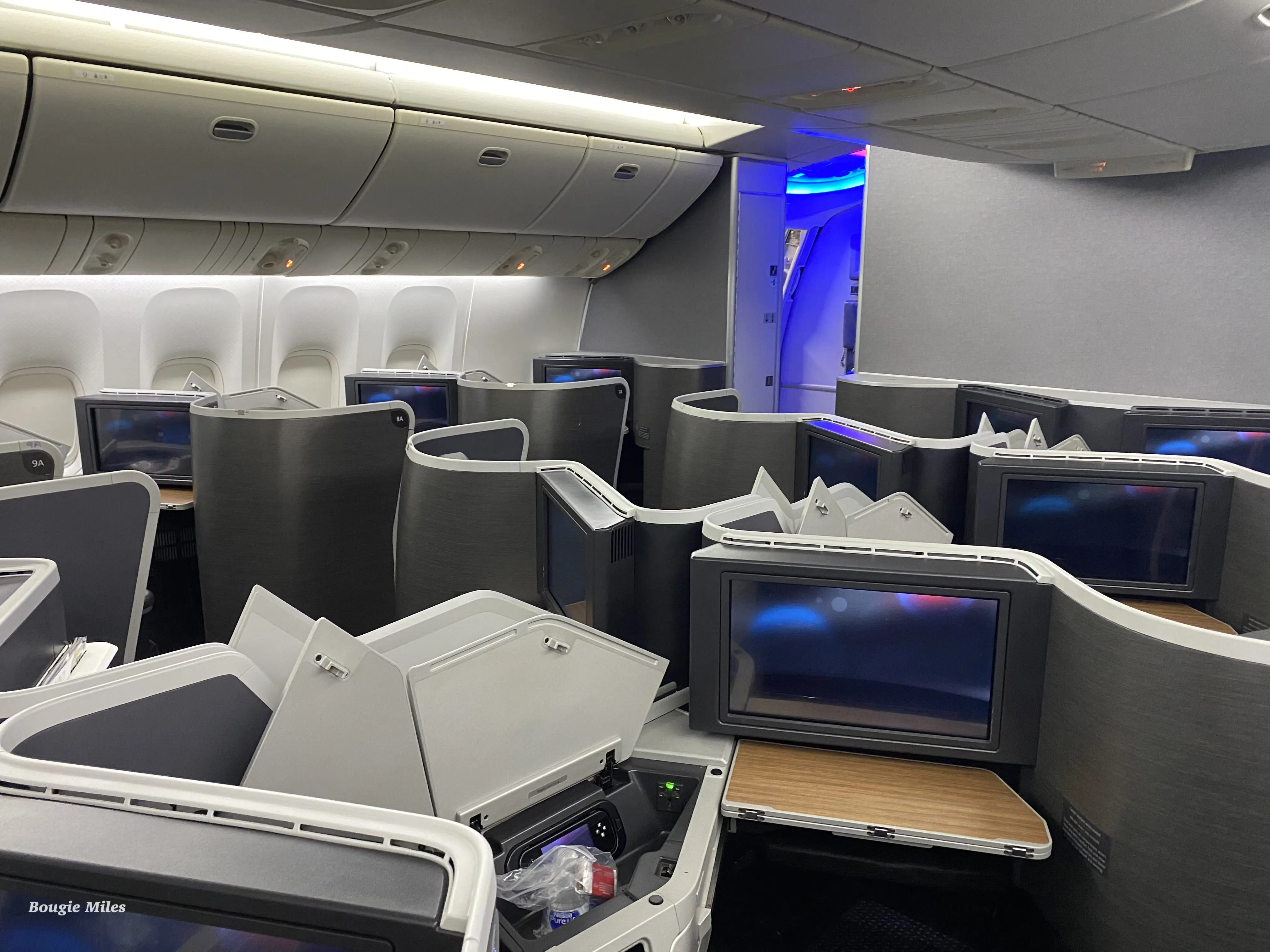 a group of televisions on an airplane