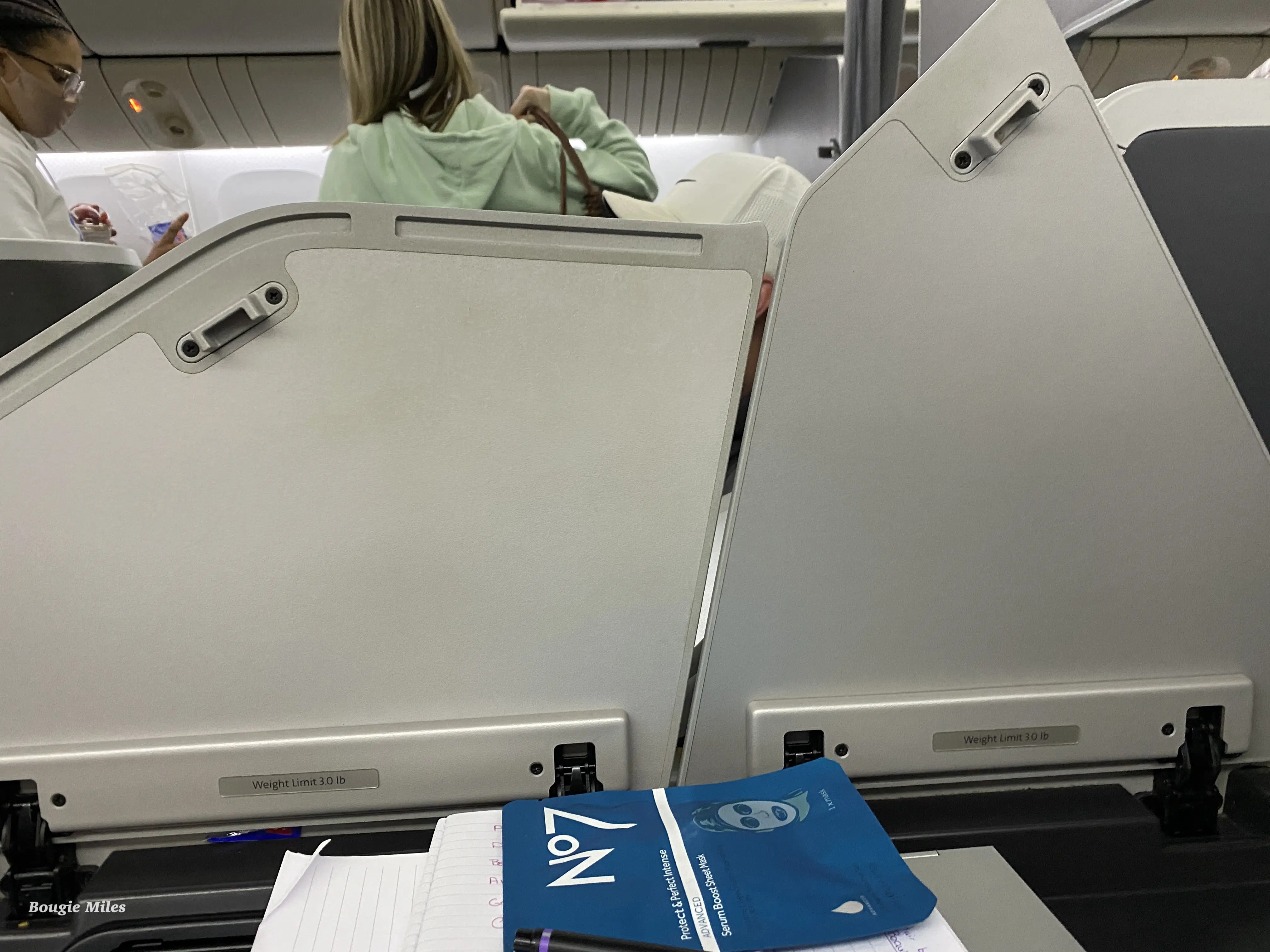 a group of people sitting in an airplane