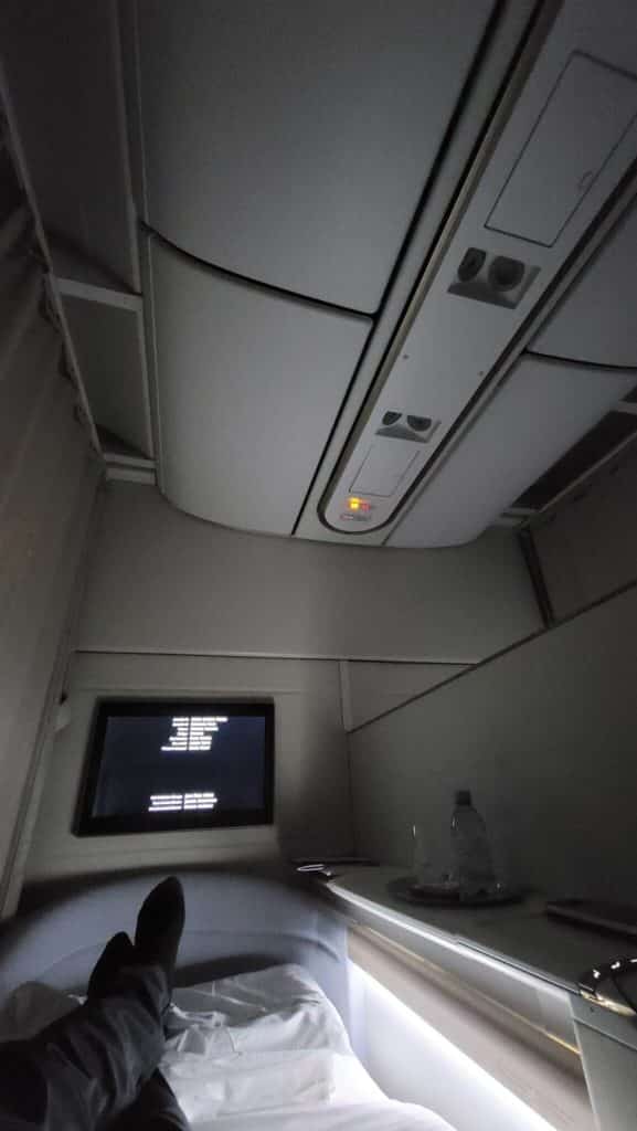 a tv and a shelf in a plane