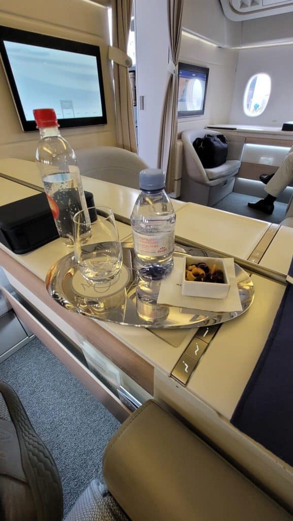 a tray of water and glasses on a table