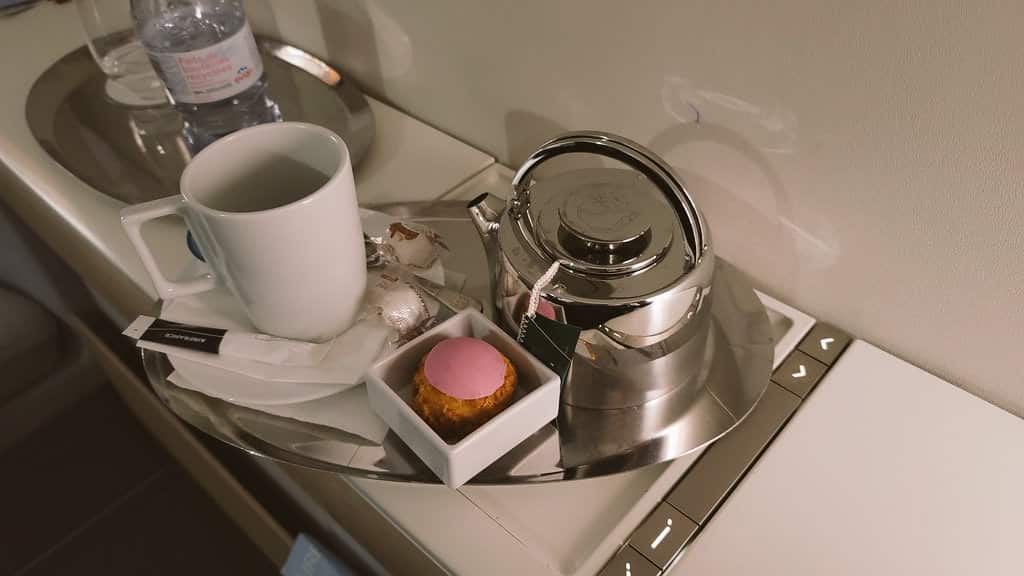 a teapot and cup on a tray