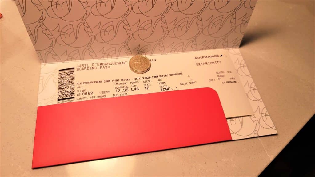 a red envelope with a coin inside