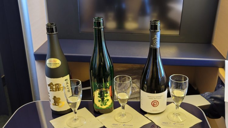 a group of bottles and glasses on a table