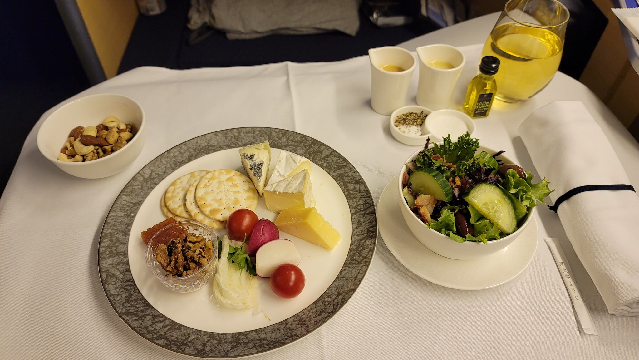 a plate of food and a salad on a table