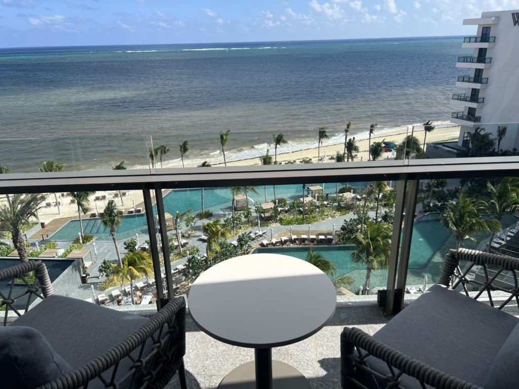 a table and chairs overlooking a beach