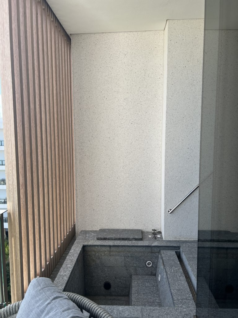 a bathroom with a tub and a shower