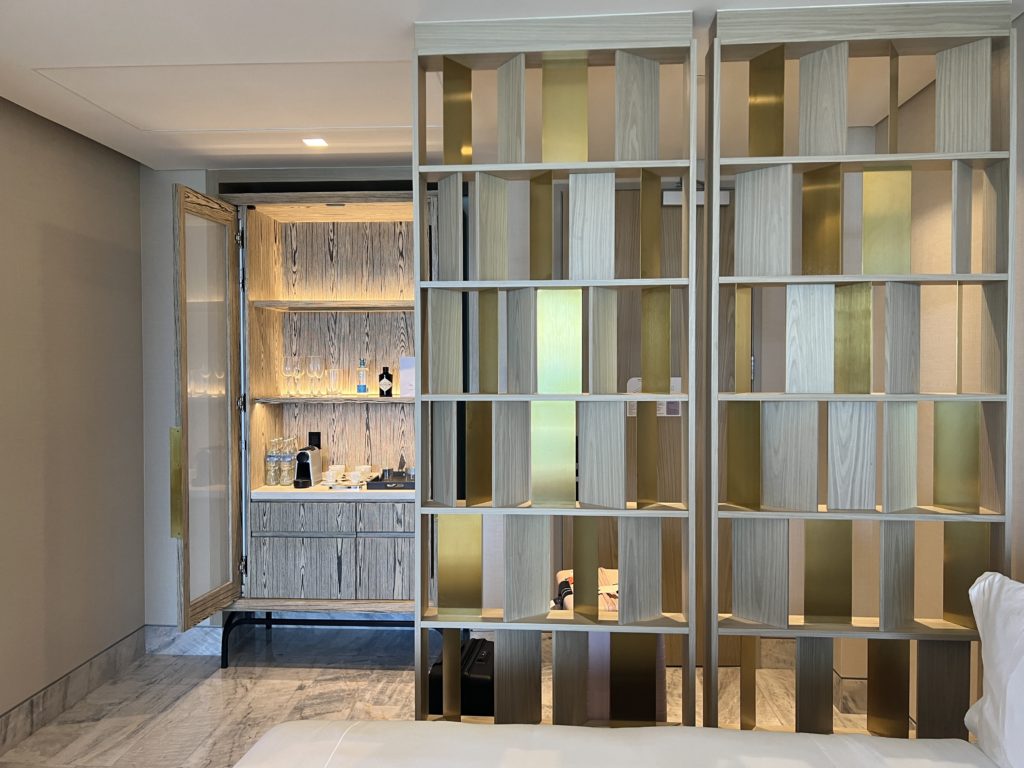 a room divider with gold and silver panels