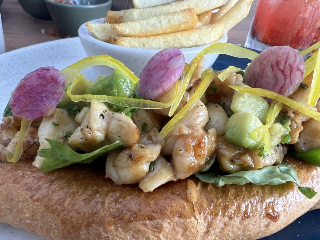 a plate of food with a bowl of fries