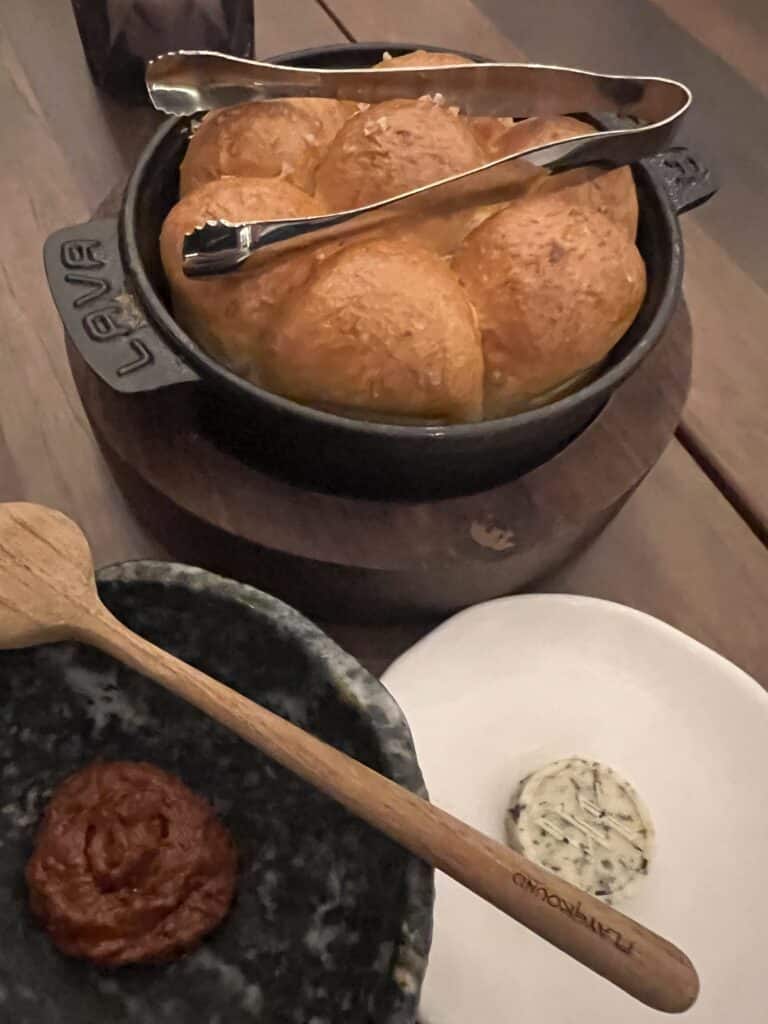 a bowl of bread and a spoon