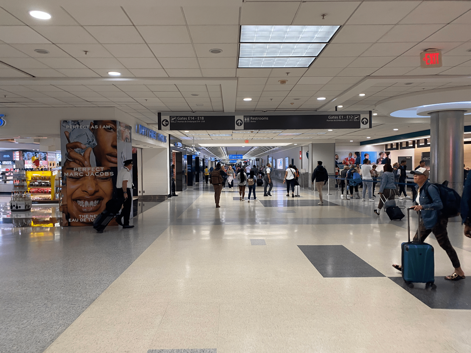 a group of people walking in a terminal