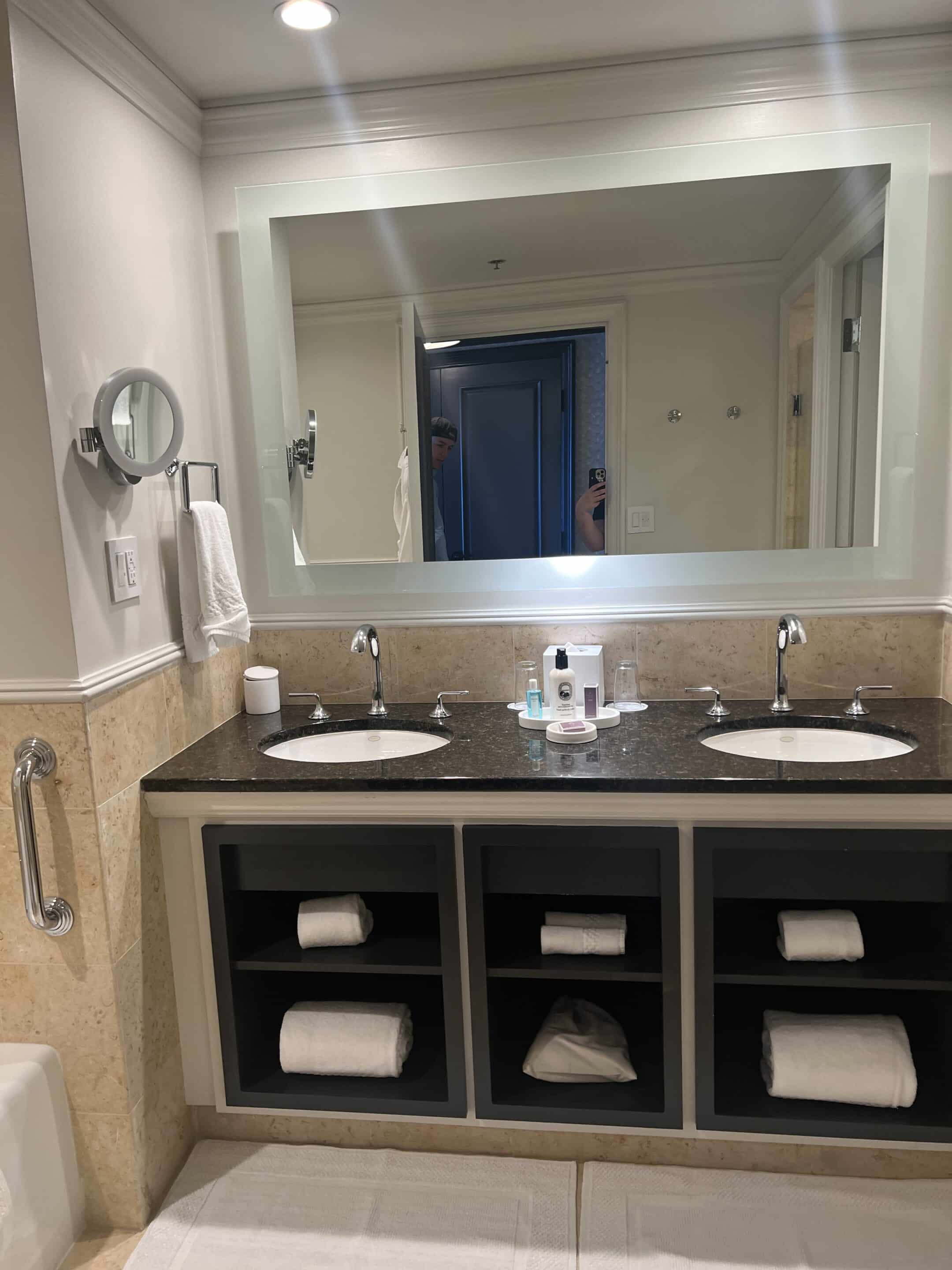 a bathroom with a mirror and sinks