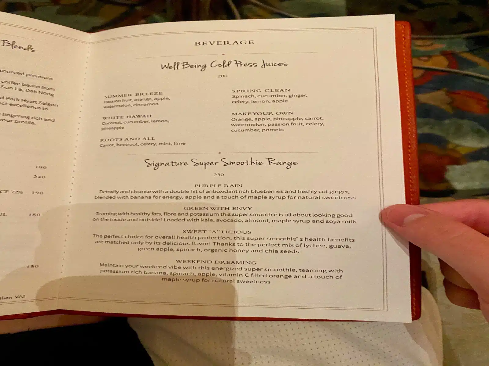 a hand holding a menu