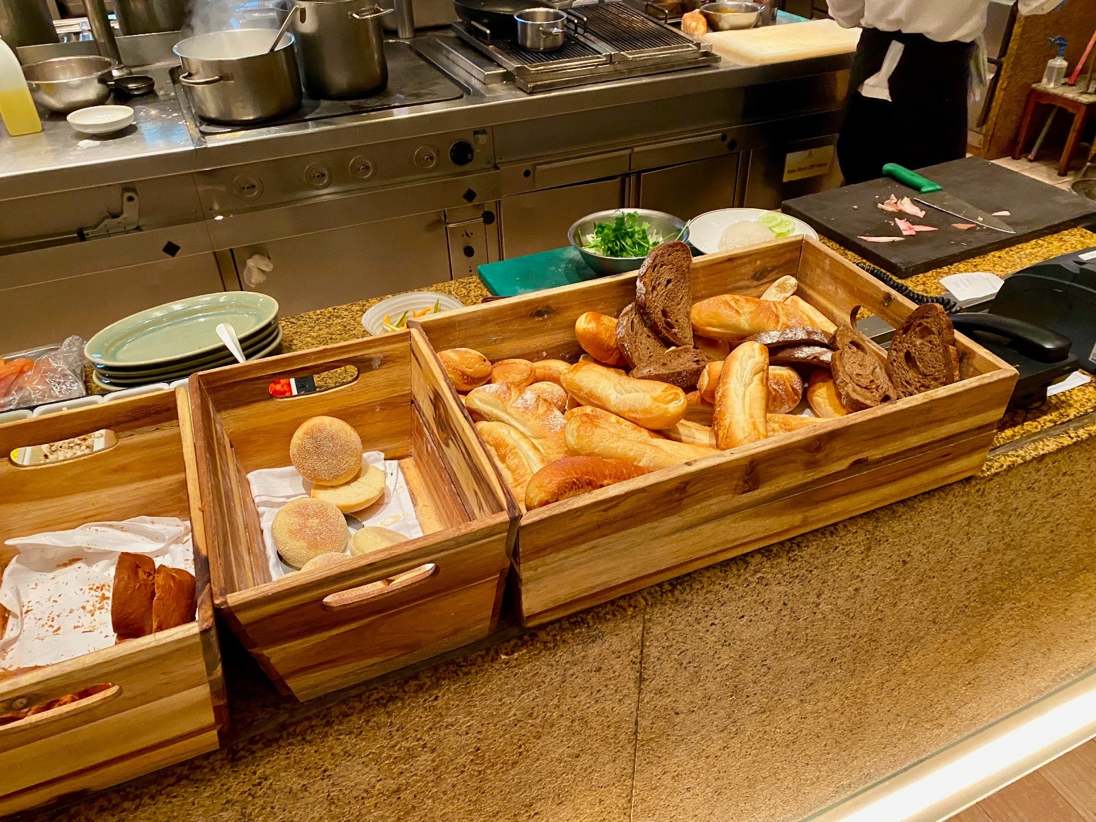 a group of bread in a wooden box