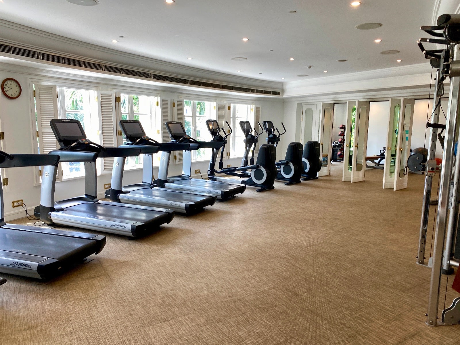 a room with treadmills and exercise machines