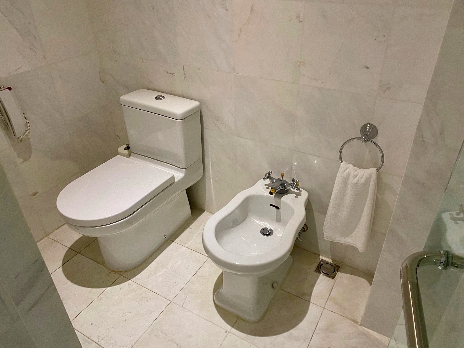 a toilet and bidet in a bathroom