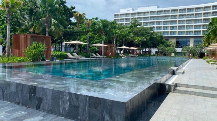 a pool with a building in the background