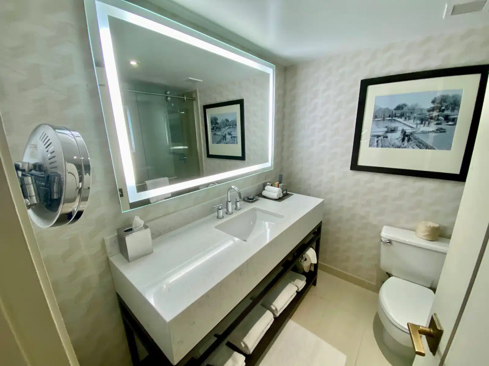 a bathroom with a mirror and a sink