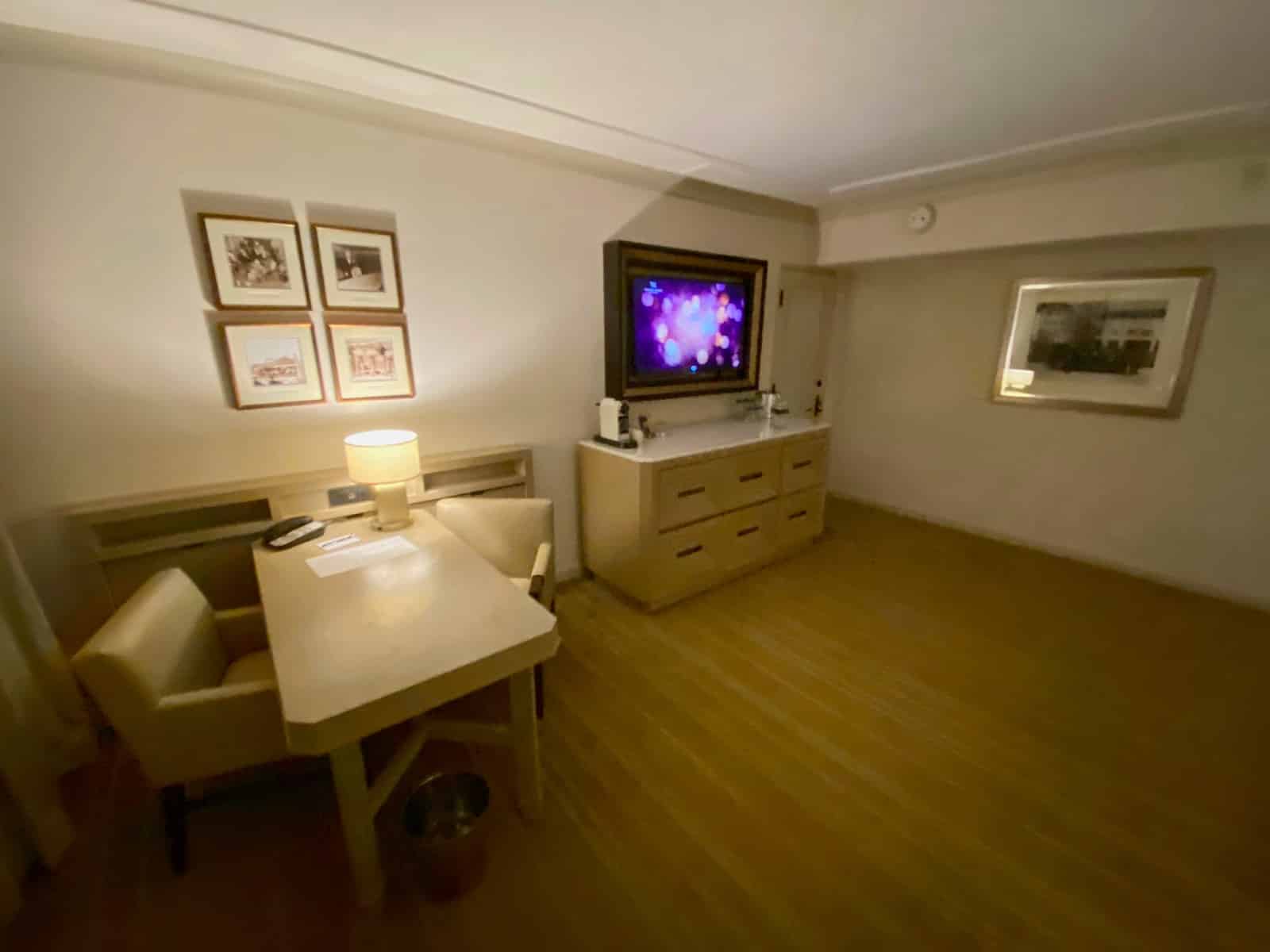 a room with a table and a tv