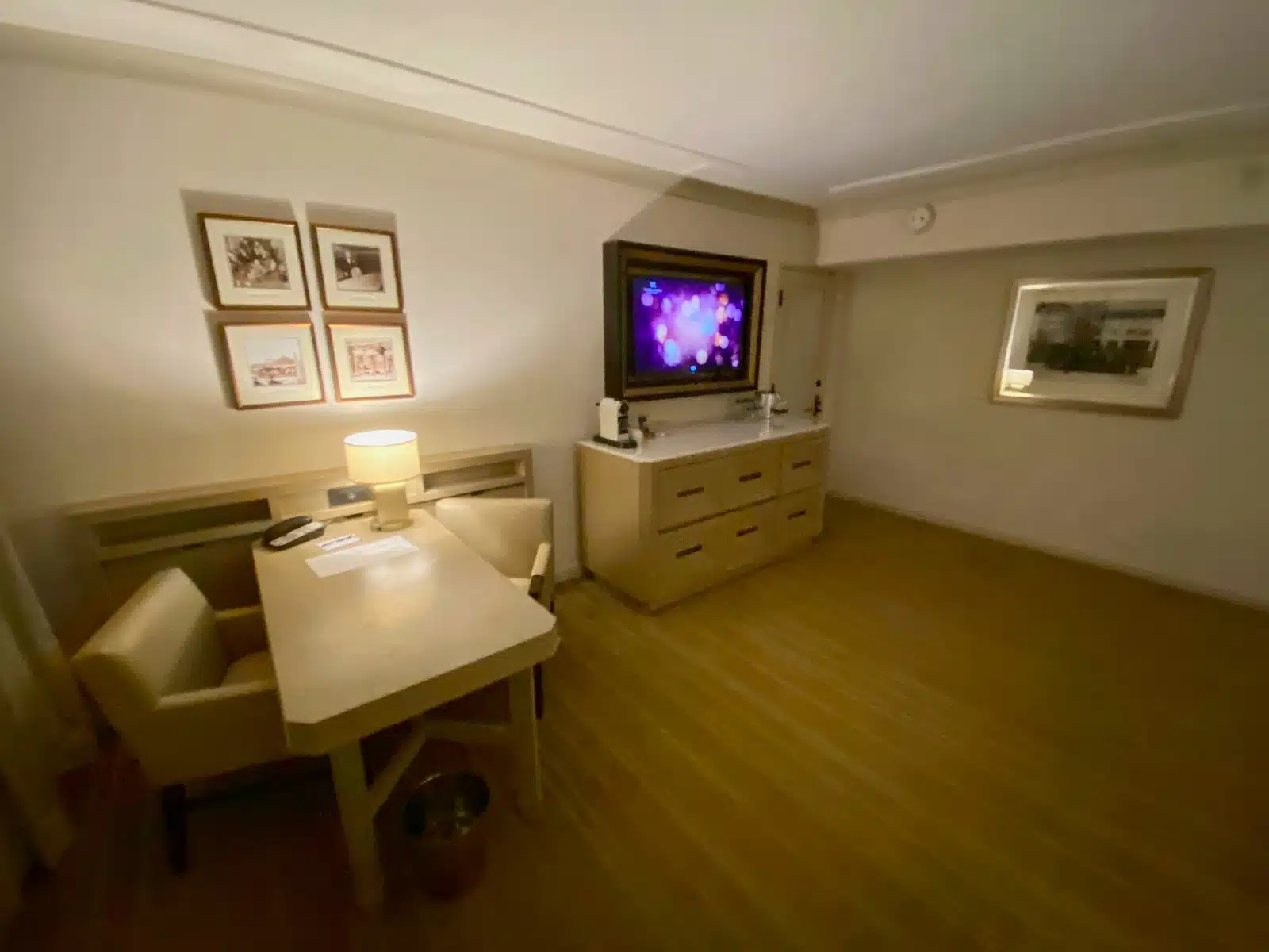 a room with a table and a tv