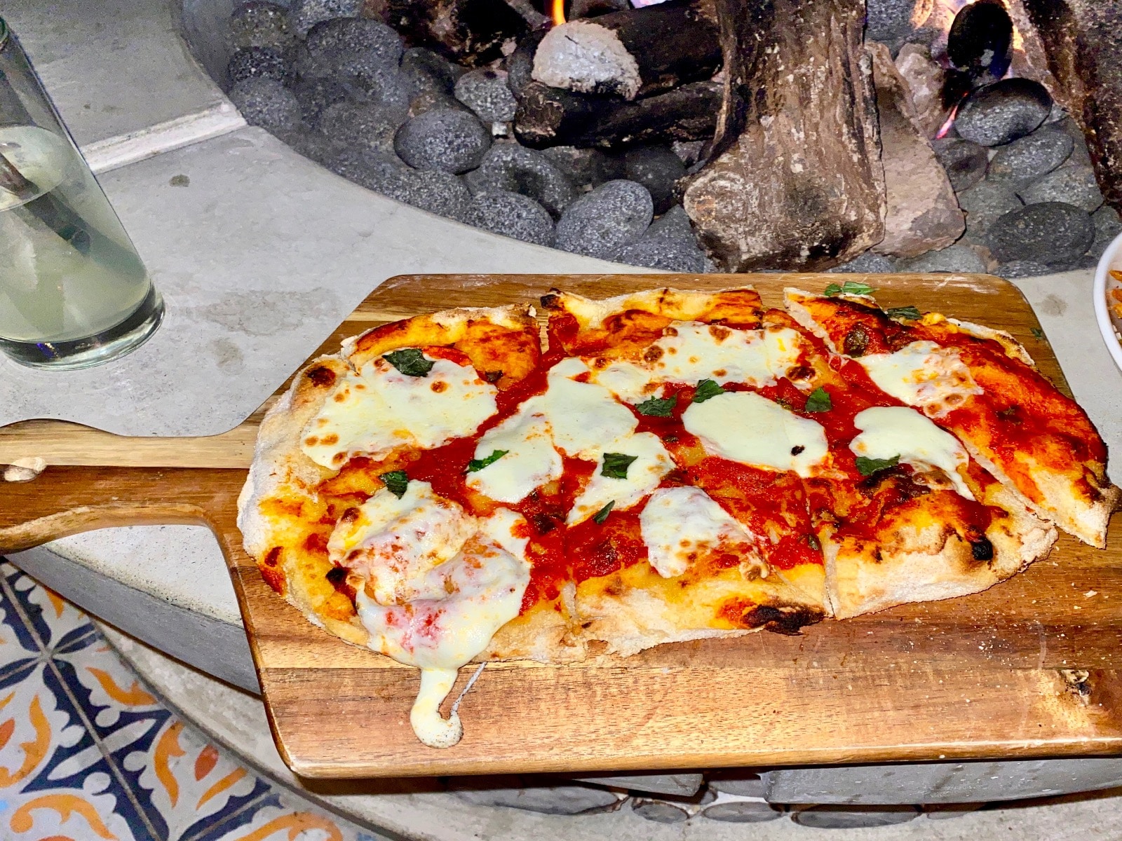 a pizza on a wooden board