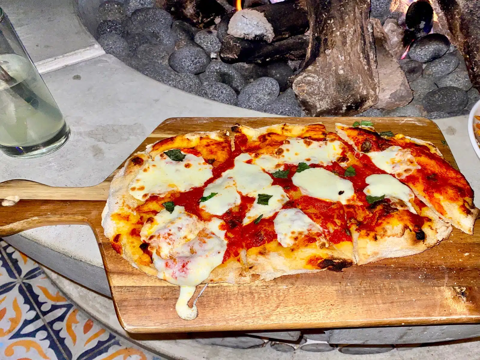 a pizza on a wooden board