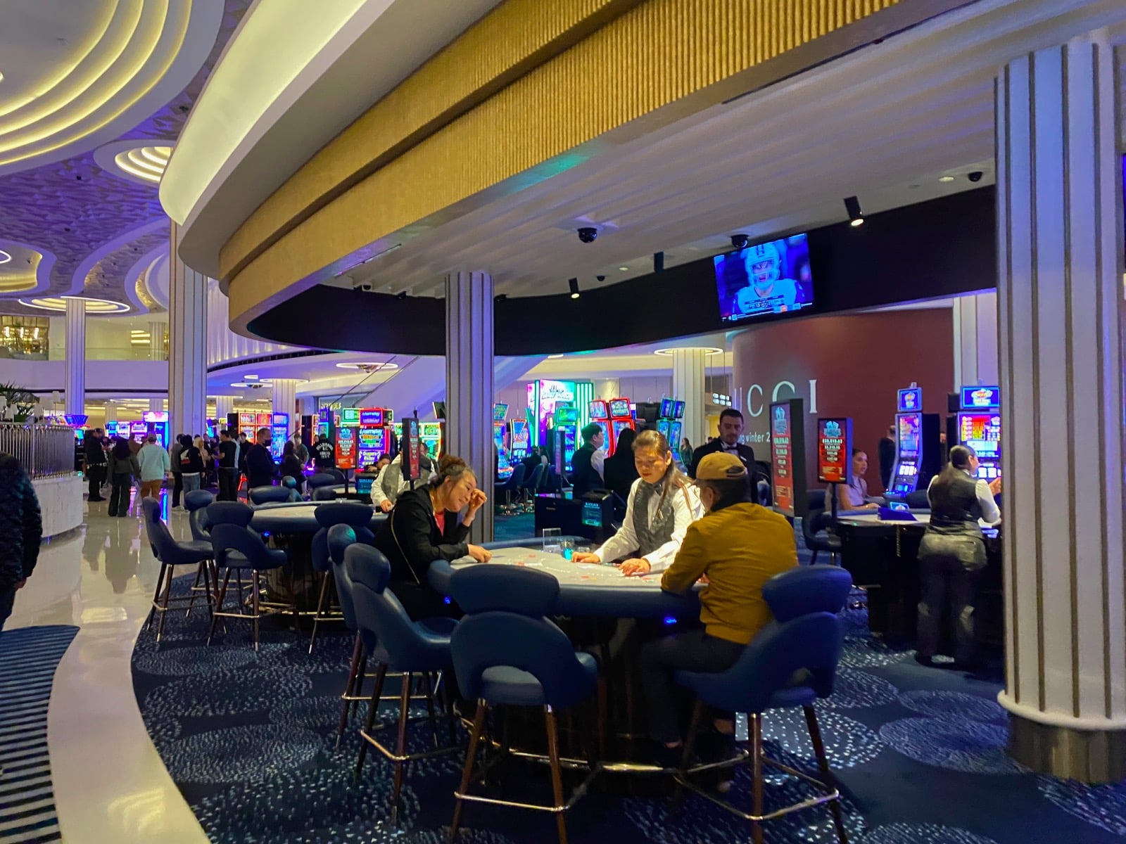 people playing cards in a casino