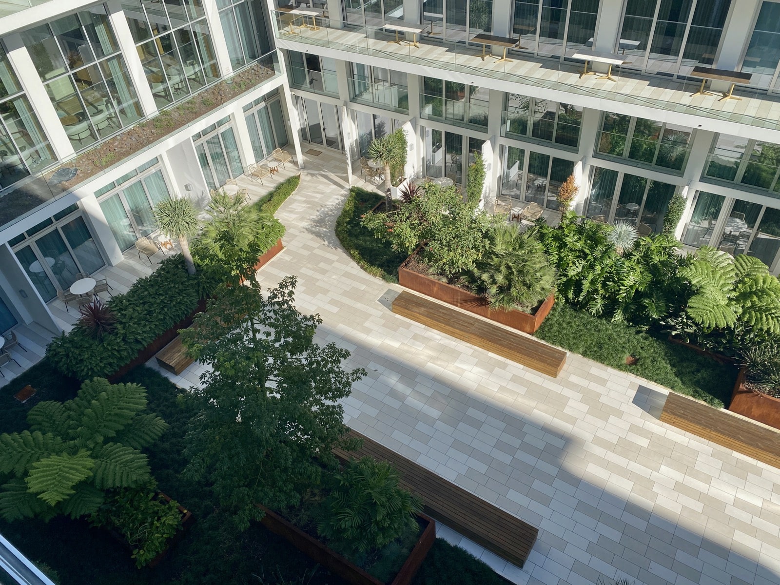 a building with a courtyard and trees