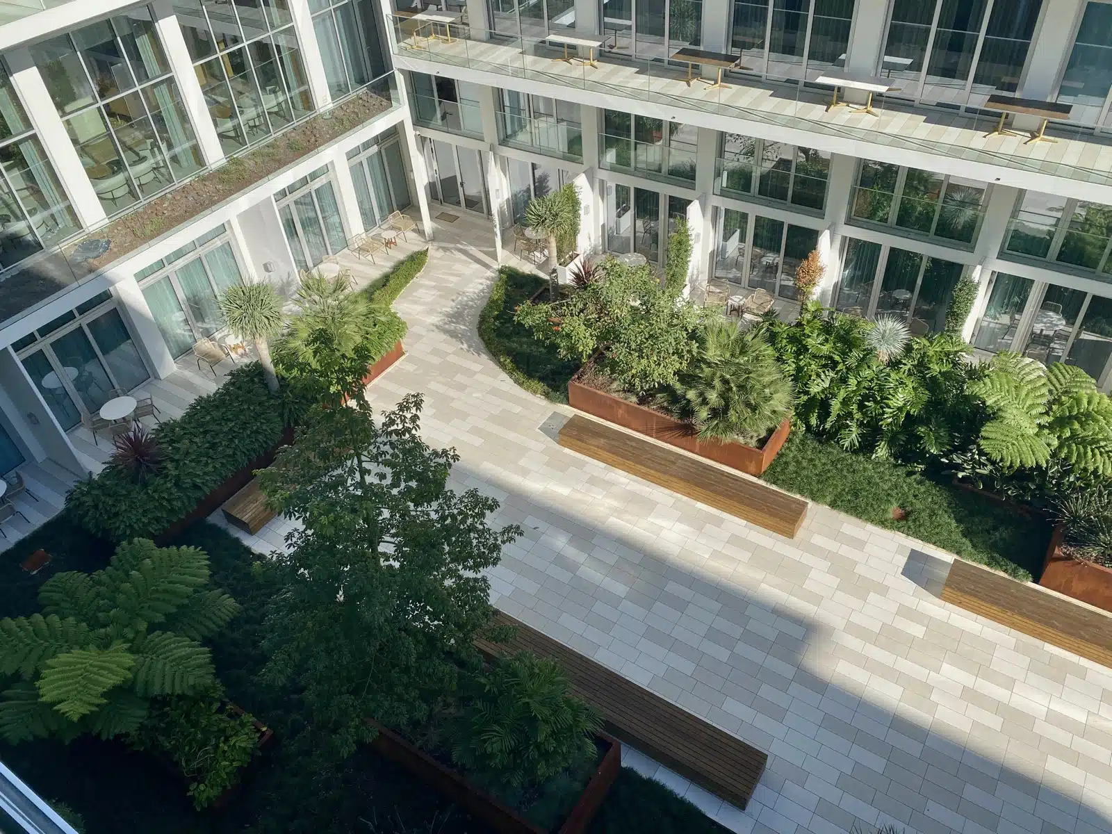a building with a courtyard and trees