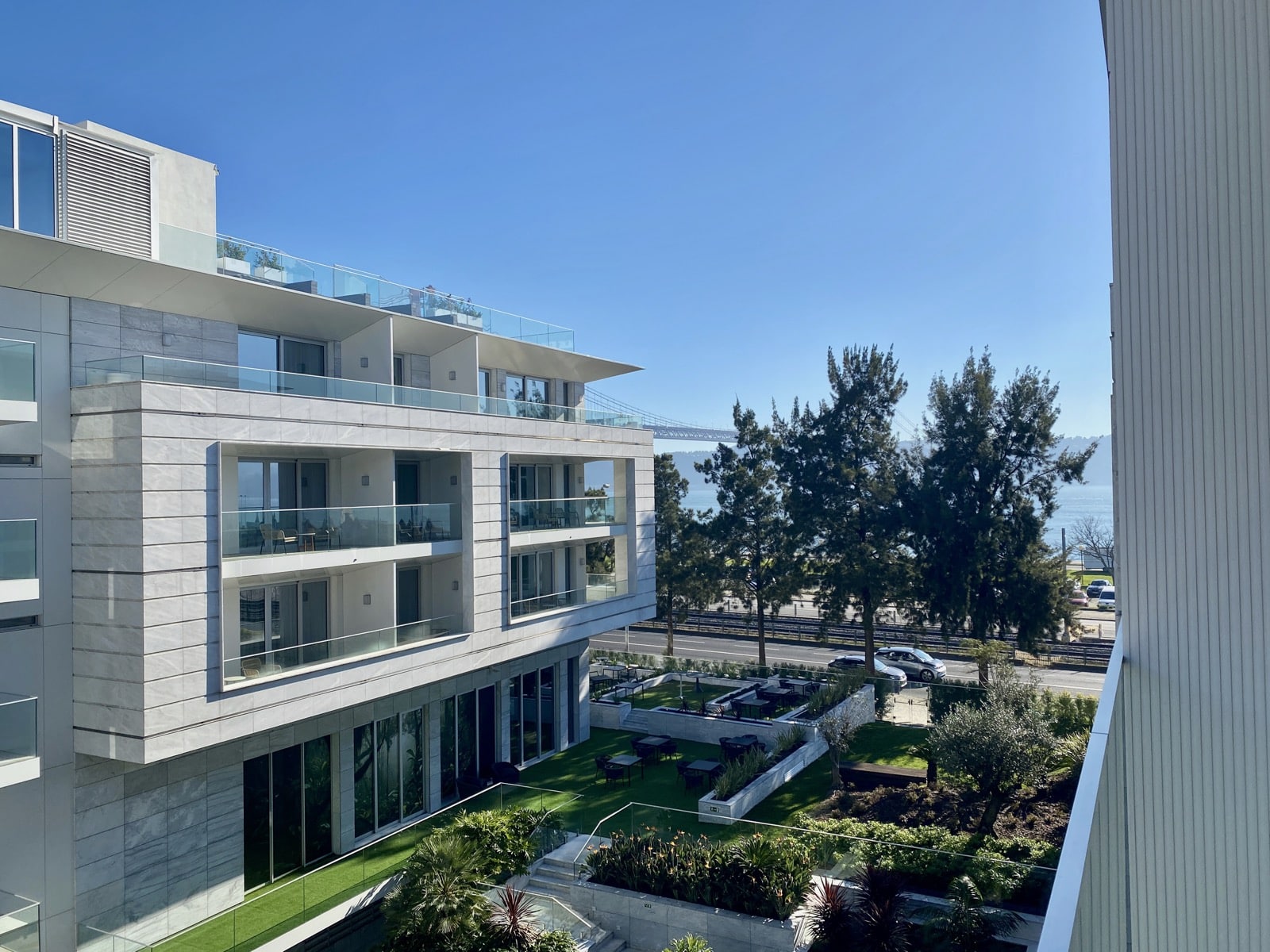 a building with a lawn and trees