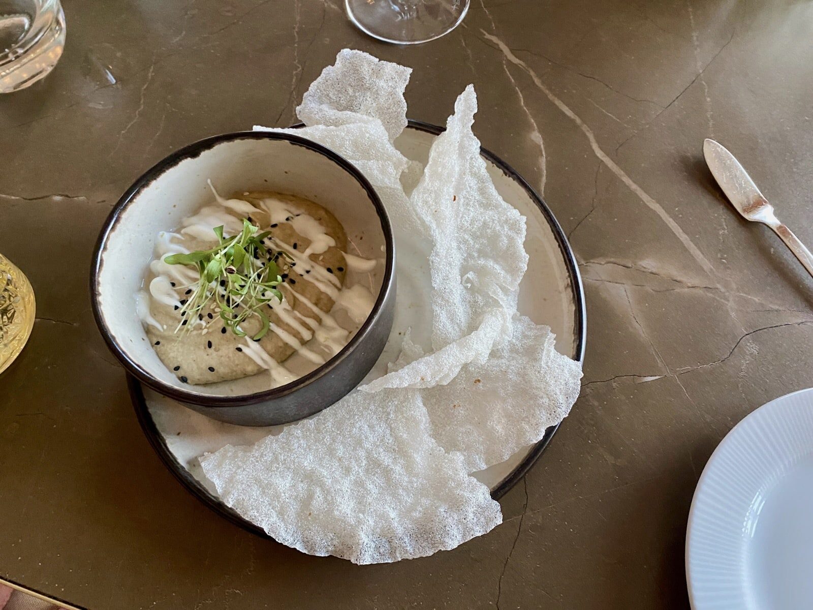 a bowl of soup on a plate