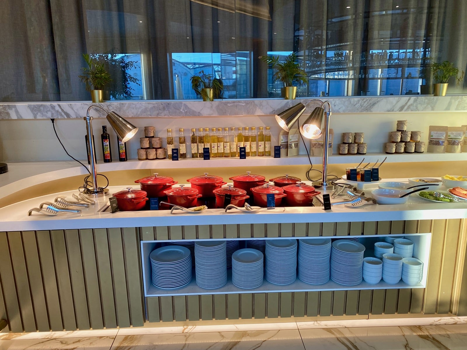 a buffet with many pots and bowls