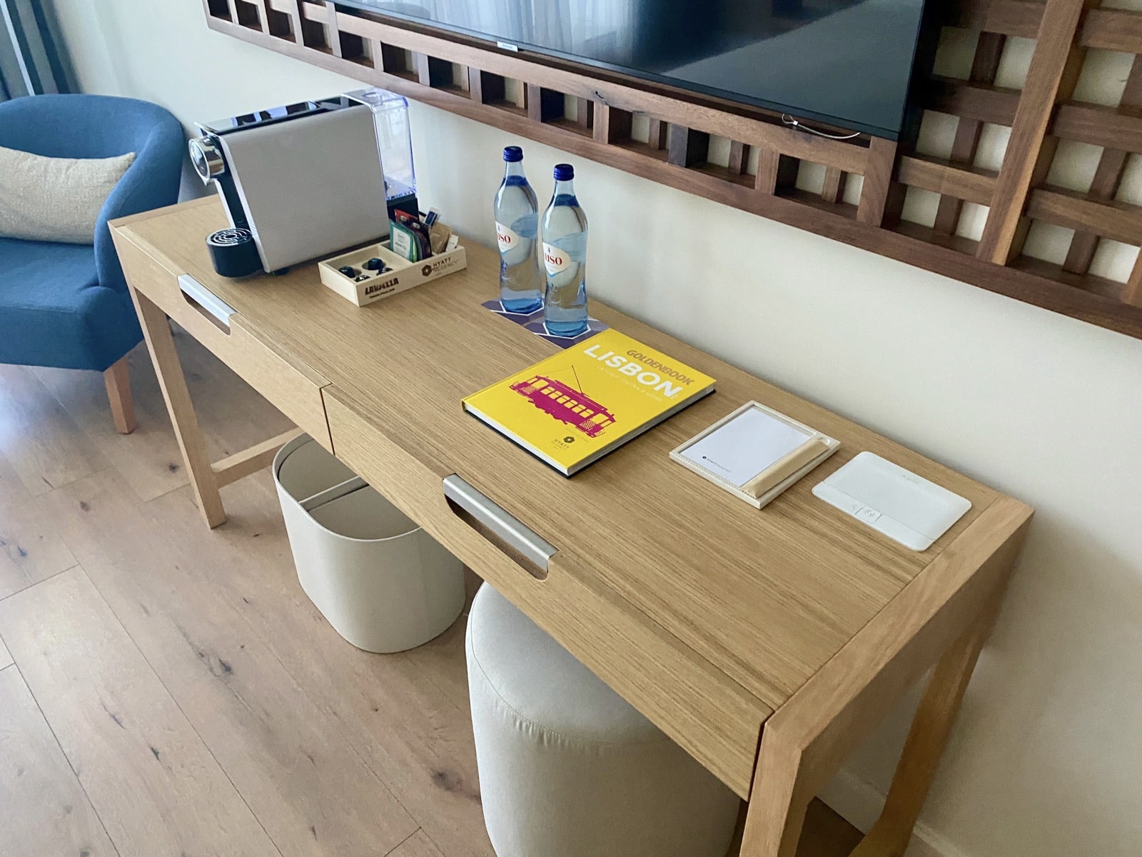 a desk with a tv and a book on it