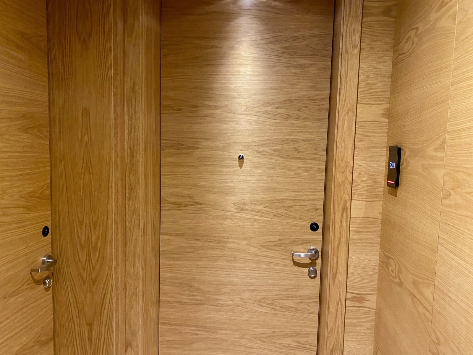 a wooden door with a light on the top