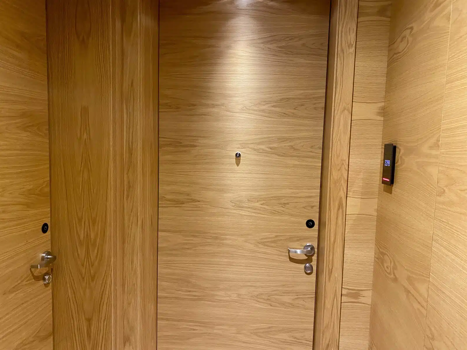 a wooden door with a light on the top
