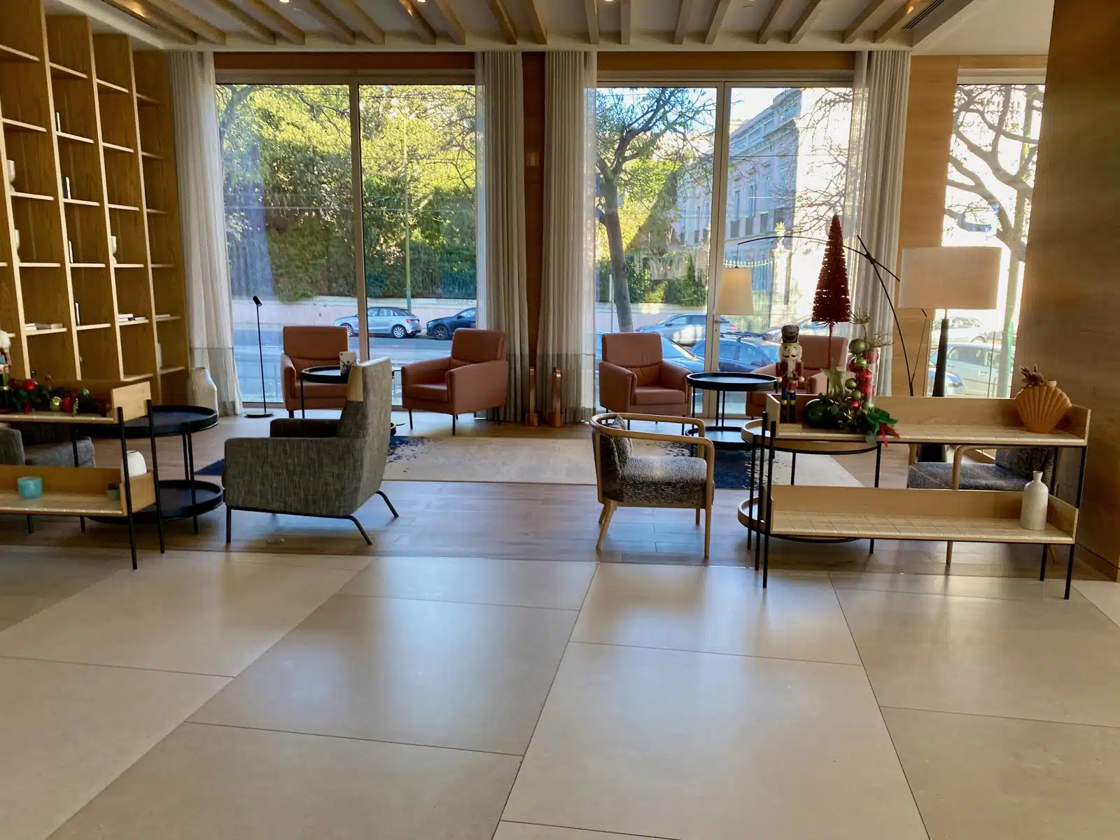 a room with a large window and chairs