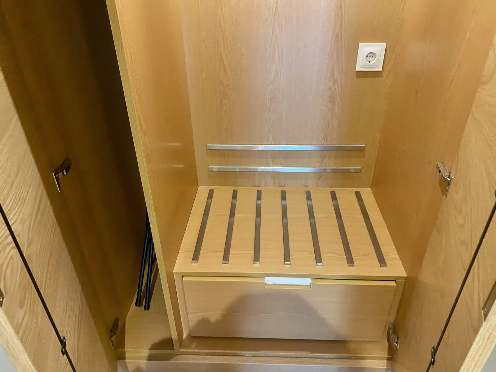 a wooden cabinet with a drawer