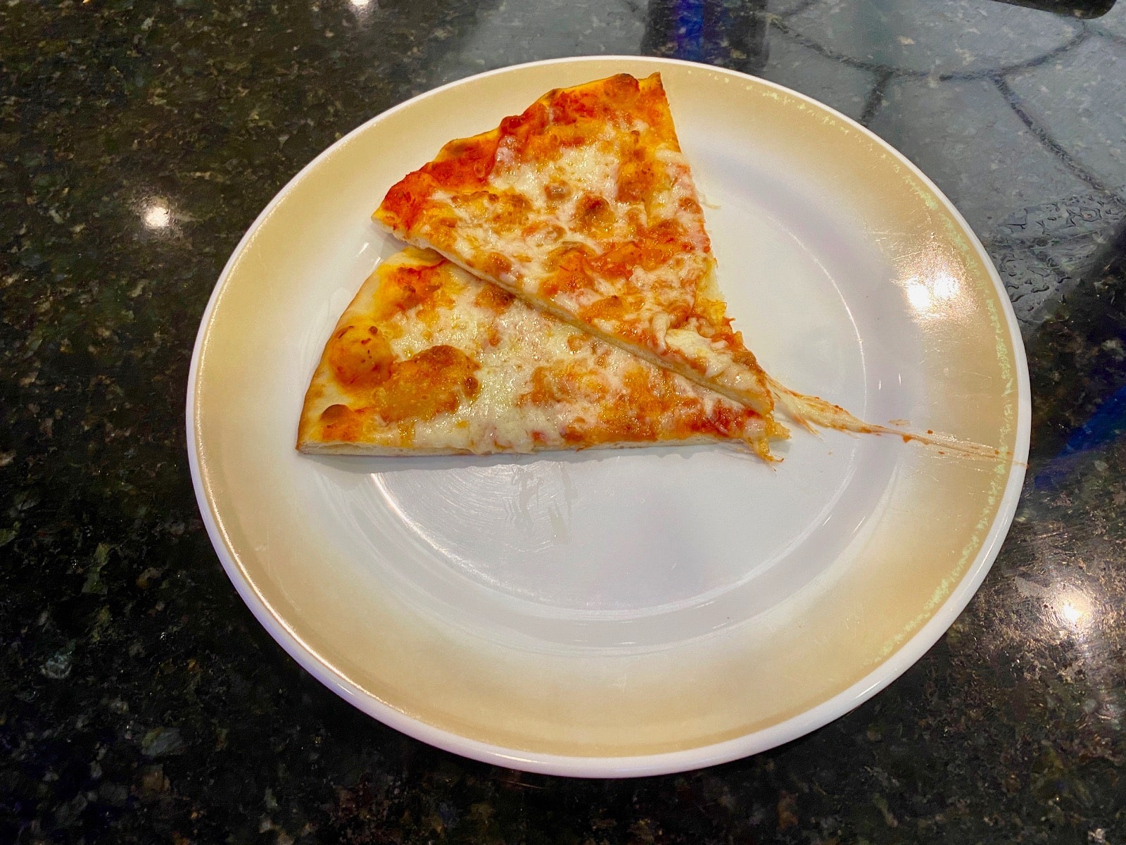 a slice of pizza on a plate