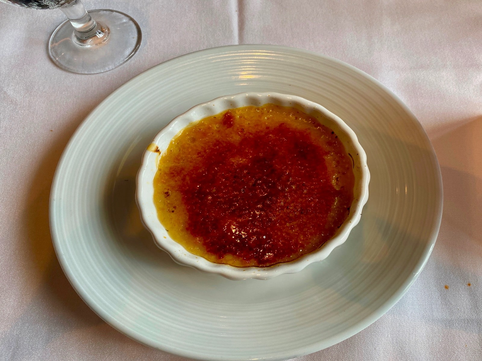 a bowl of creme brulee on a plate