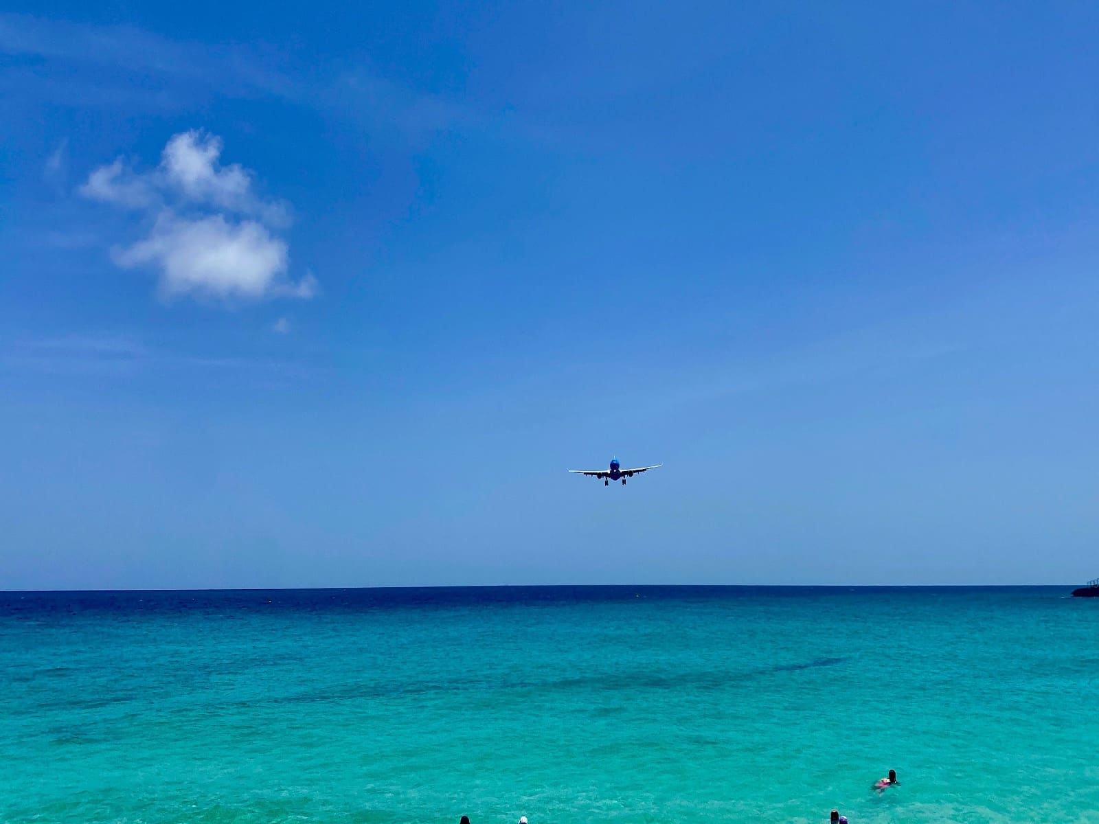 an airplane flying over the ocean